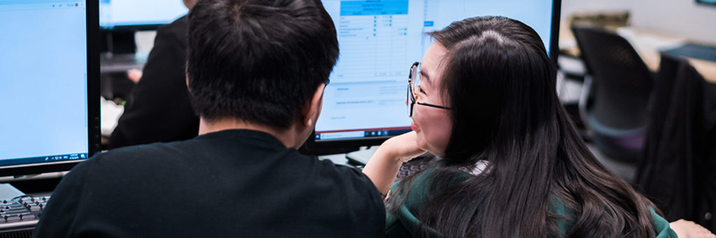 two people on computers talking