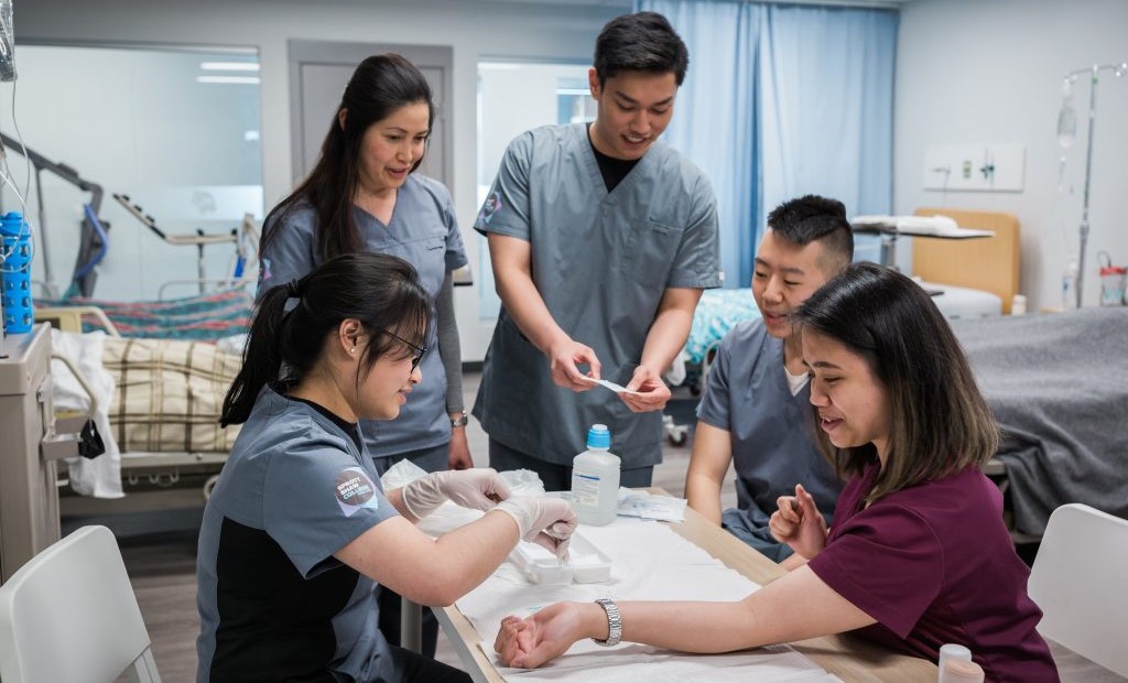 Sprott Shaw College practical nursing students in their nursing lab.
